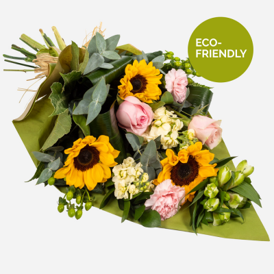 Day Break - Brighten the dullest of days with this glorious array of flowers. Send amazing sunflowers with a complement of selected blooms... Bright and stunning flowers swathed in a wrap friendly and natural. Flowers are hand delivered by the local florist.