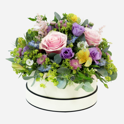 Rainforest - The brightest beautiful blooms arranged in oasis crammed with natural delight and flair.
