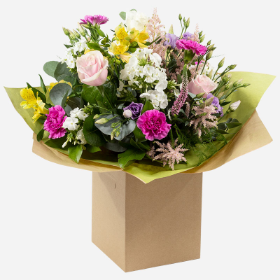 Hidden Treasure - An outstanding hand tied bouquet with a cascade of colour and a treasure chest overflowing with the beautiful flowers.