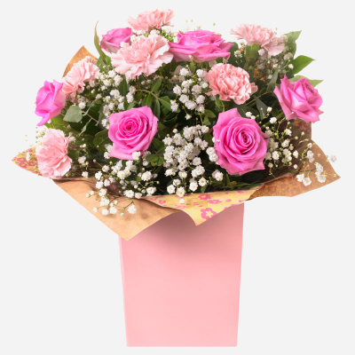Roses & Ruffles

 - Pink Roses and Carnations make this gift timeless and classic